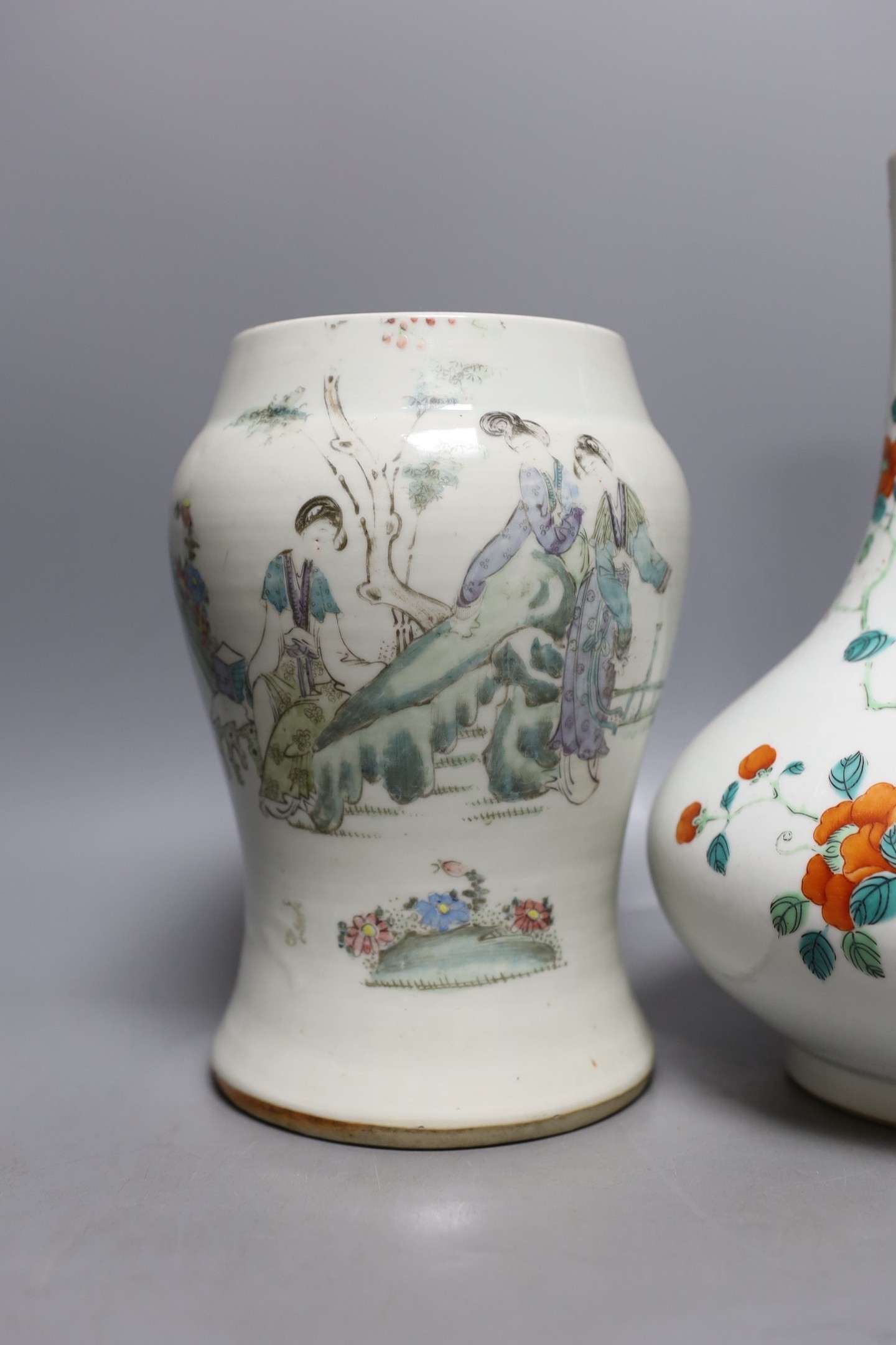 A Chinese enamelled porcelain bottle vase, 25cm high, together with a Chinese porcelain baluster jar, early 20th century, painted with figures and script